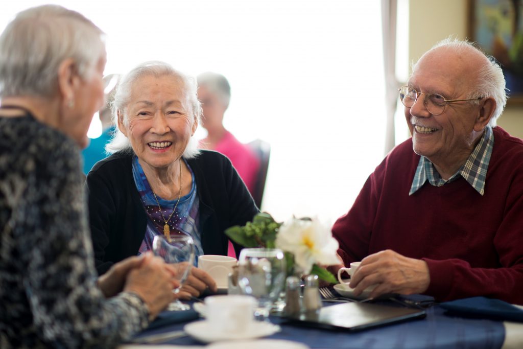 seniors having dinner at an assisted living facility