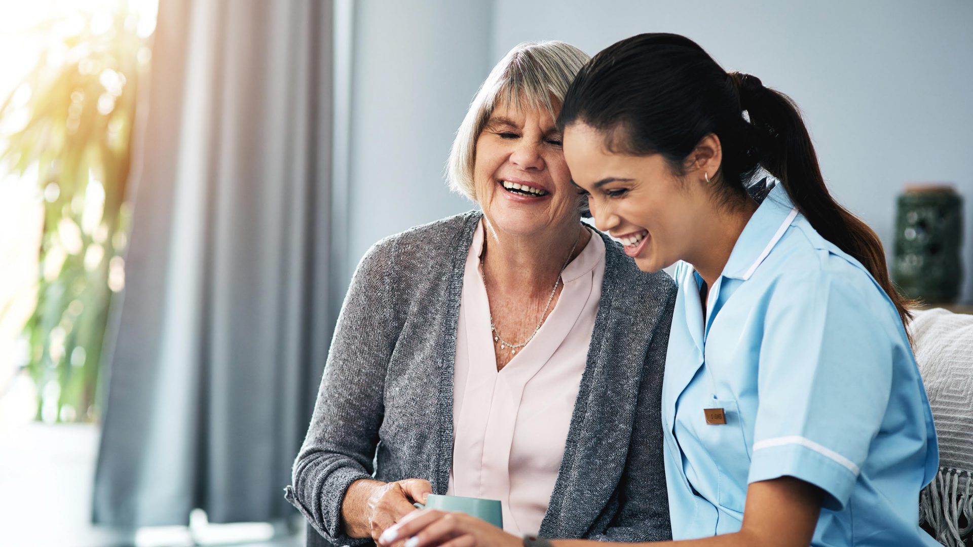 Caregiver speaking with a senior resident