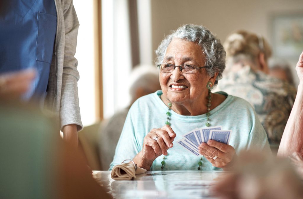 senior lady playing cards