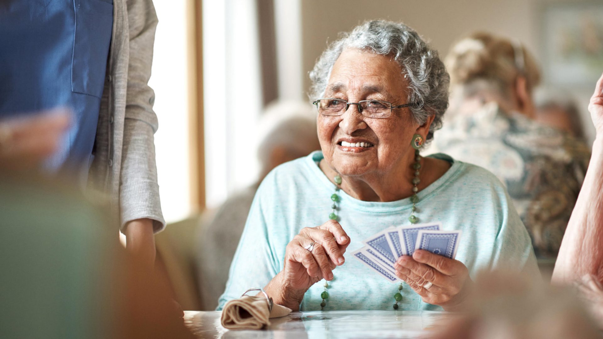 senior lady playing cards