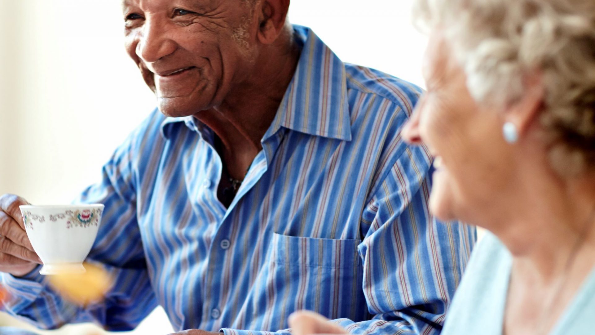 seniors chatting over coffee and tea